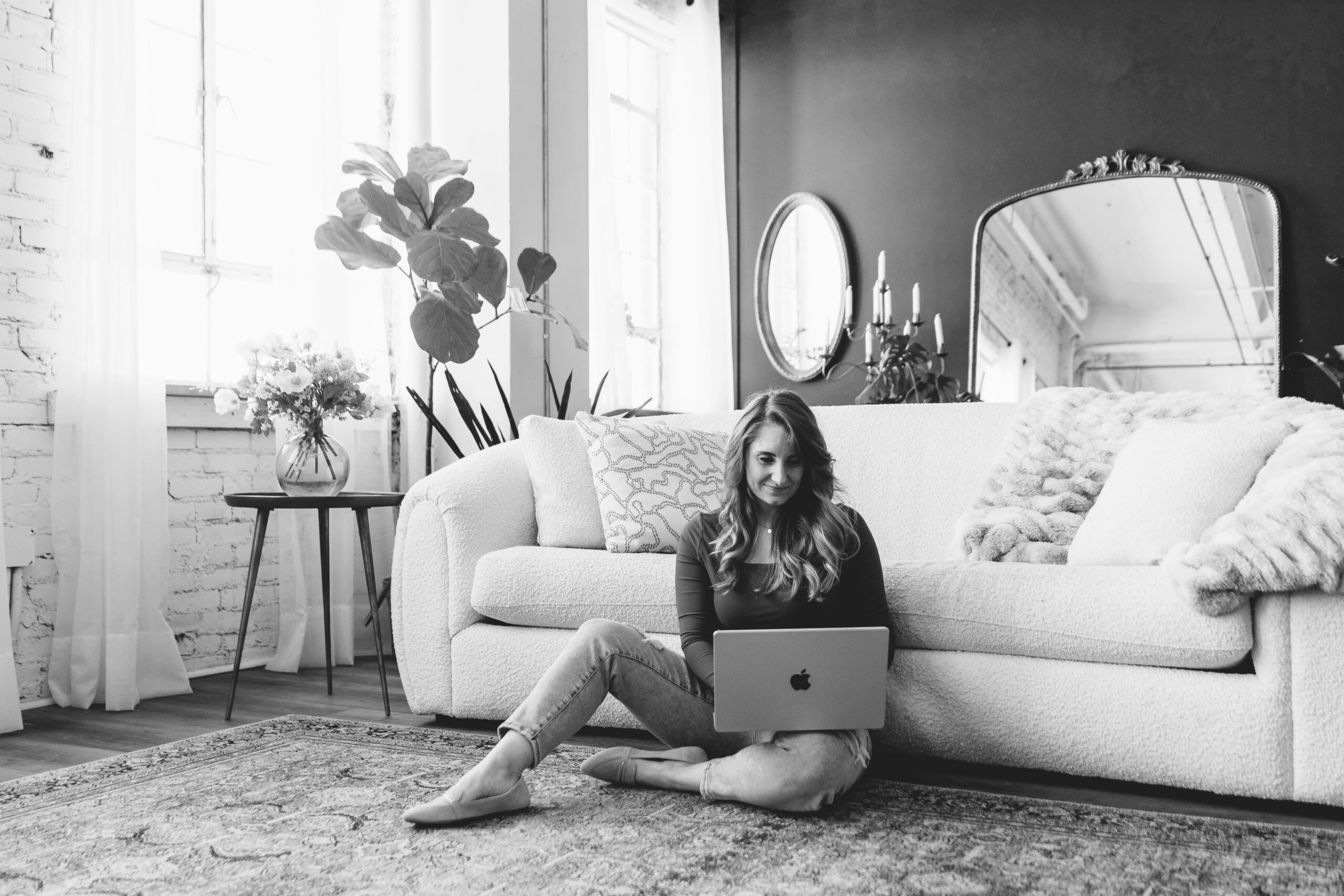 woman working on laptop for the benefits of seo